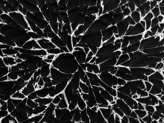 Cracked glass texture on black background. Isolated realistic cracked glass effect
