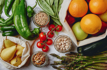 Zero waste grocery shopping. Package-free food on marble background. Flat lay