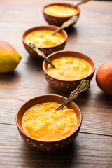 Mango Pulp / Aam rus or Ras served in small bowls, selective focus