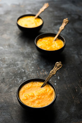 Mango Pulp / Aam rus or Ras served in small bowls, selective focus