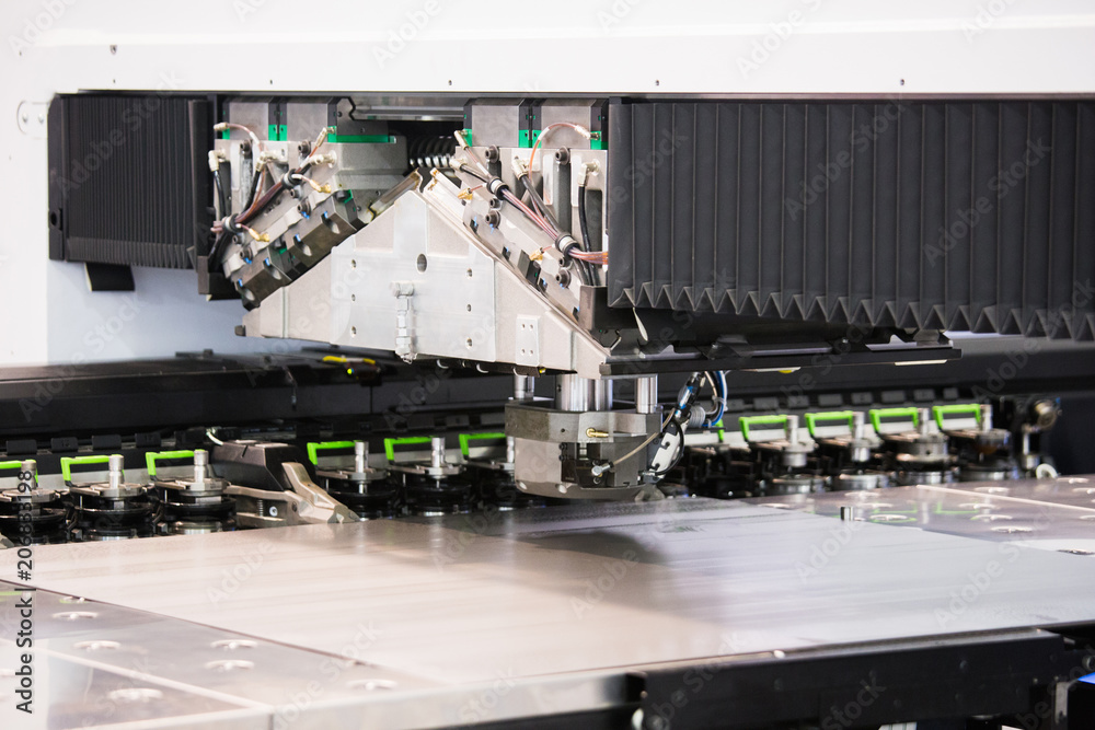 Aufkleber robot for stamping metal products during work. modern automated factory