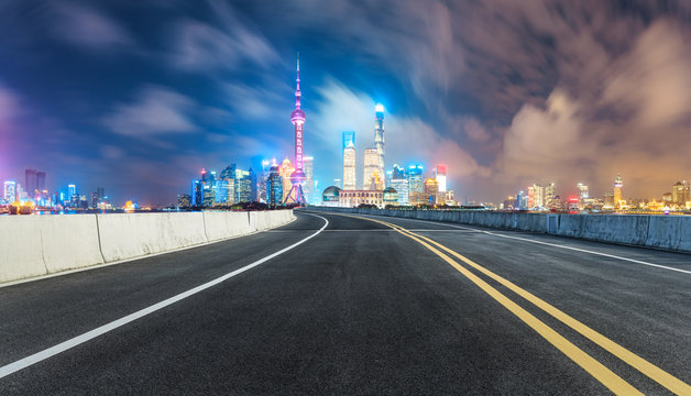 clean asphalt road with modern city skyline background,shanghai,china
