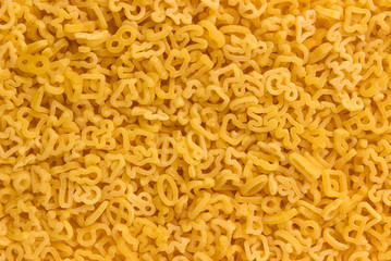 Raw pasta for kids,  pasta background.