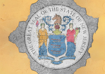 Fototapeta premium US state New Jersey flag seal in big concrete cracked hole and broken material facade structure