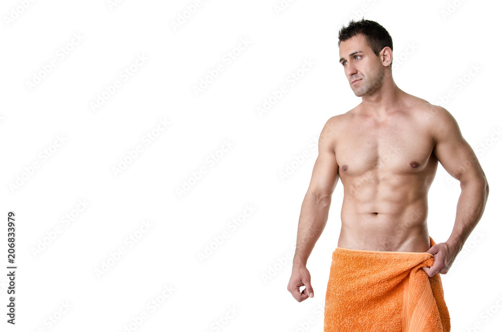 Wall mural young athletic man. after shower. white background.