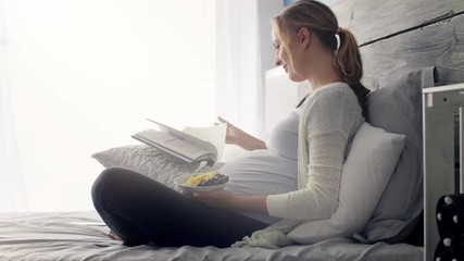 Pregnant woman resting at bedroom  - Powered by Adobe