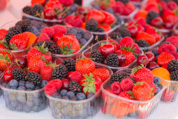 Ripe berries in trays on the store shelves