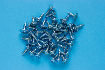 pile of nails on a blue background