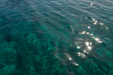 azure coast with white sand, clean and clear blue water on a sunny day