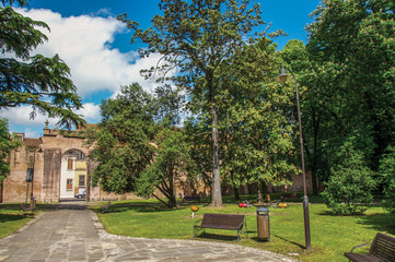 Fototapeta premium Overview of the beautiful and leafy Park Pareschi in the city center of Ferrara, a graceful and important medieval town. Located in the Emilia-Romagna region, northern Italy