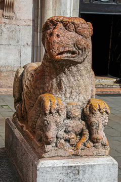Close-up of granite griffin sculpture in front of Ferrara Cathedral. In the city center of Ferrara, a graceful and important medieval town. Located in the Emilia-Romagna region