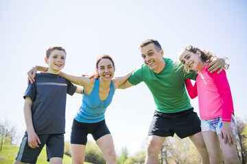 Parents with children sport running together outside