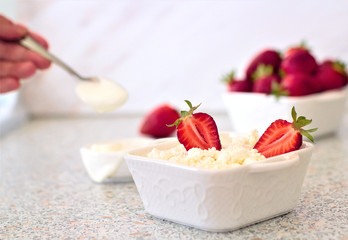 Tasty food. A dish of fresh strawberries and cottage cheese. Vitamin supplement. Dietary and vegetarian product. Add healthy and nutritious food to your diet.