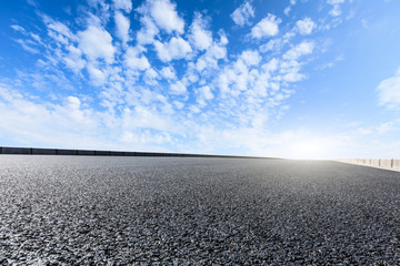 new asphalt road and sky clouds