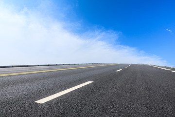 Fototapeta premium new asphalt road and sky clouds