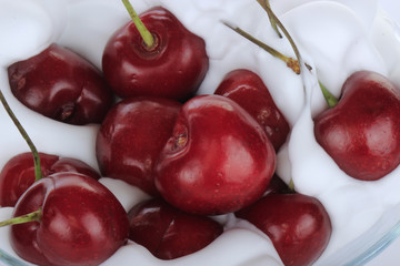 red cherry in white cream