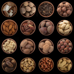 set of nuts in wooden cups isolated on black background. top view