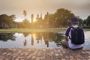 Obraz premium Tourist is traveling at Sukhothai Historical Park in Thailand.
