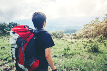 Fototapeta na wymiar Tourist and Traveler Man with backpack the mountain in forest