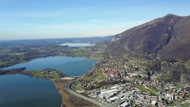 A panoramic aerial view of lake Oggiono from drone