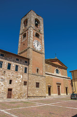 Overview of old buildings and bell tower with clock at Colle di Val d Elsa. A graceful village with its historic center preserved and known by its crystal production. Located in the Tuscany region 