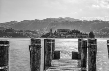 Obraz premium View of San Giulio island from Orta San Giulio, Novara province, Italy. it is part of the circuit of the most beautiful villages in Italy and is awarded the orange flag by the Italian Touring Club.