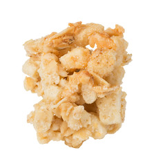 Single cereal crisp close-up isolated on a white background.