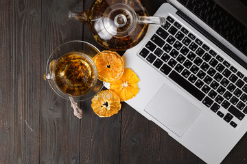 Healthy breakfast with orange fruit chips  on wooden table with copy space