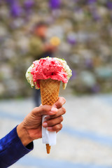 Cone of gelato in hand