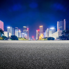 street and skyscrapers of a modern city at night