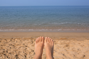 Woman's Bare Feet on the beach.