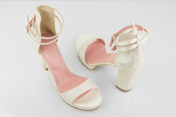 Elegant Luxury Laced Bridal Wedding Shoes On White Background Closeup
