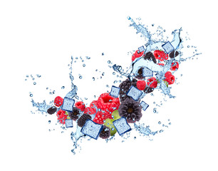 Water splash with berries, blackberry, raspberry isolated on white background. 