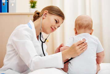Young doctor examining baby infant with stethoscope. 