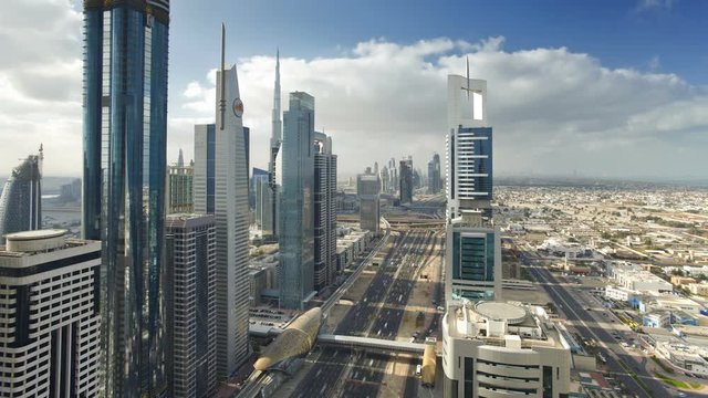 United Arab Emirates, Dubai, Timelapse over Sheikh Zayed Rd, showing the new MTR track and station system and the Burj Khalifa, the worlds tallest building