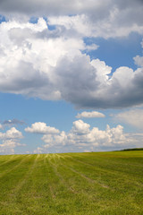 Fototapeta premium Storm clouds are moving quickly on the fields