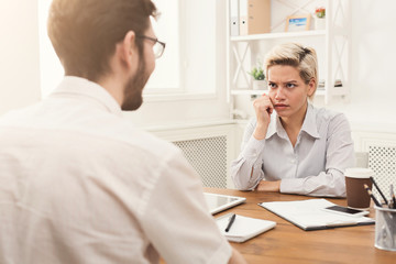 Couple of business partners work at modern office