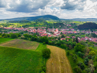 Aerial view. Medieval Saxon Church in Saschiz Village, Transylvania, Romania. Unesco World Heritage...