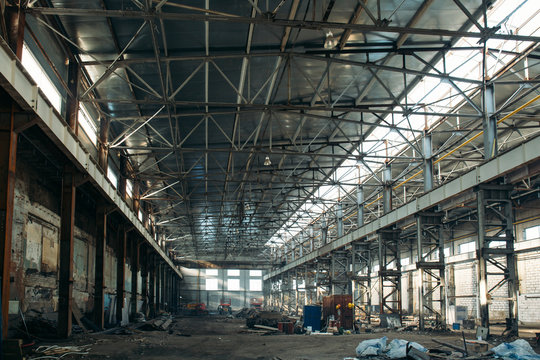Large empty industrial hangar or storage warehouse interior