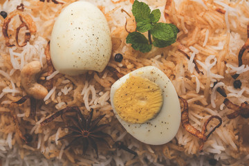 Egg Biryani - Basmati rice cooked with masala roasted eggs and spices and served with yogurt,...