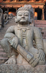 Fototapeta na wymiar Statue at famous Nyatapola Temple at Durbar square in Bhaktapur, Kathmandu valley, Nepal