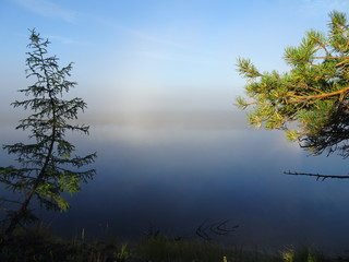 Landscape: early morning - a river in the fog