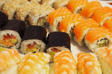 Philadelphia roll sushi with salmon, smoked eel, cucumber, avocado, cream cheese, red caviar. Sushi menu. Japanese food. Healthy food
