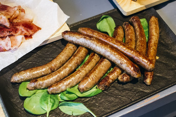 Sausages on hot stone