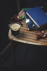 black coffee and foam in a transparent steklnny cup (portion of hot coffee)