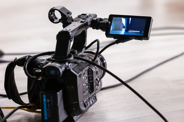 Professional video camera on the floor
