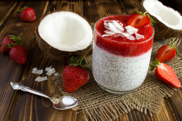 Pudding with chia,strawberry  and coconut milk on the rustic wooden background