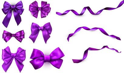 Purple realistic satin bows and ribbons isolated on white.