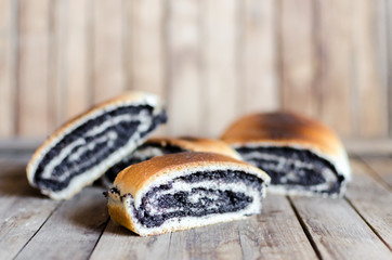 rustic poppy seeds strudel slices on wooden table