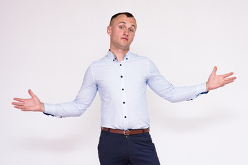 portrait of a young handsome man on a white background in different poses showing different emotions.